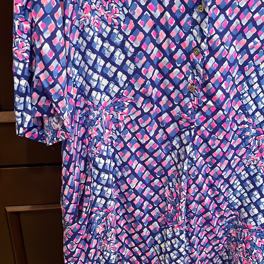 Lilly dress. New w/o tags. Never worn. Had sleeves professionally shortened.